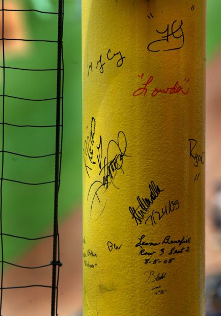 Fans sign foul pole on final season